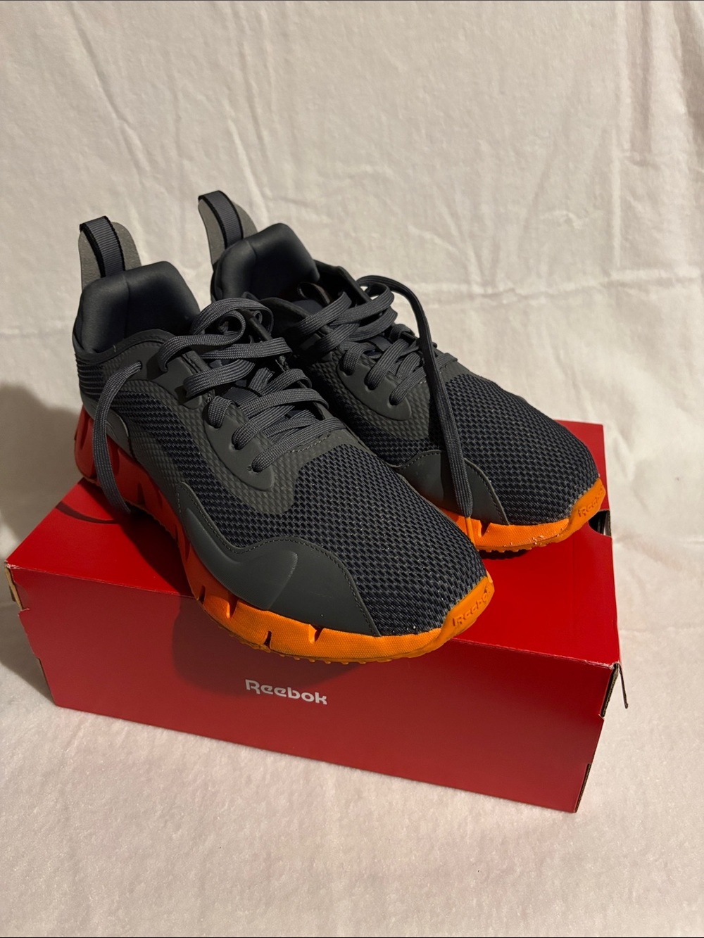 Reebok Men’s Black Mesh Sneakers with Orange Outsole